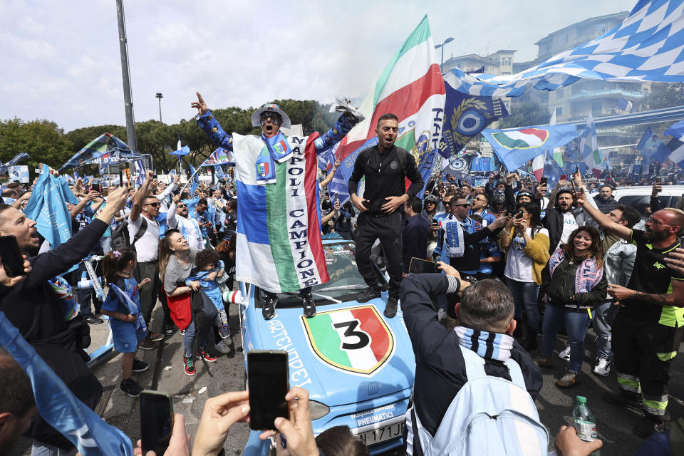 Napoli fans celebrate ahead of a Serie A soccer match between Napoli and Salernitana, in Naples, Italy, Sunday, April 30, 2023. Napoli could end a wait of more than three decades for the Serie A title. Napoli will know the permutations before its match against Salernitana. If second-placed Lazio fails to win at Inter Milan earlier in the day, then a Napoli win will clinch the scudetto. (Alessandro Garofalo/LaPresse via AP)