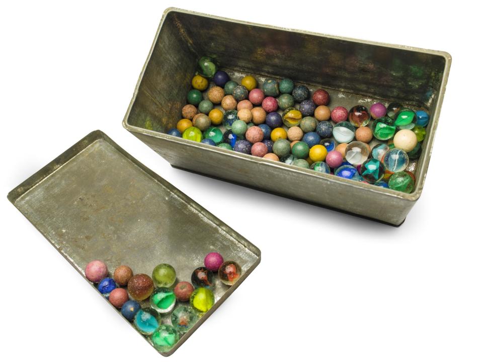 This Nov. 14, 2013 photo provided by the Anne Frank House Amsterdam on Tuesday, Feb. 4, 2014, shows a set of marbles belonging to Anne Frank. Shortly before Anne Frank and her family went into hiding from the Nazis, she gave away some of her toys to non-Jewish neighborhood girlfriend Toosje Kupers for safekeeping. The toys have now been recovered and Anne's tin of marbles will go on display for the first time this week at an art gallery in Rotterdam, the Anne Frank House Museum says. (AP Photo/Anne Frank House Amsterdam, Diederik Schiebergen))