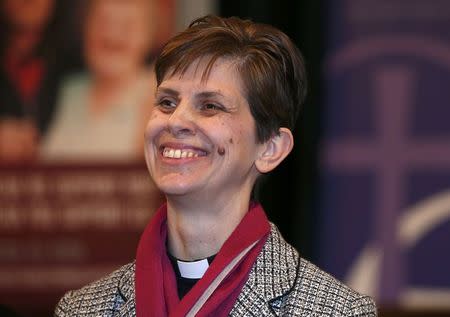 Libby Lane, a suffragan (Assistant) bishop in the Diocese of Chester, smiles as her forthcoming appointment as the new Bishop of Stockport is announced in the Town Hall in Stockport, northern England December 17, 2014. On her appointment, Lane will become the Church of England's first female bishop. REUTERS/Phil Noble