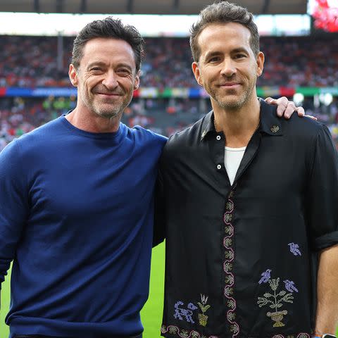 <p>Boris Streubel - UEFA/UEFA via Getty</p> Hugh Jackman and Ryan Reynolds