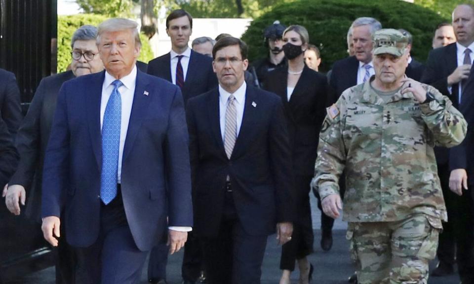 Donald Trump departs the White House on 1 June, with Mark Esper and Gen Mark Milley to his left.