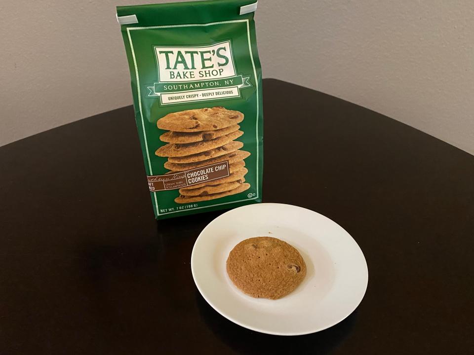 package of tates chocolaue chip cookies with cookie on a plate in front