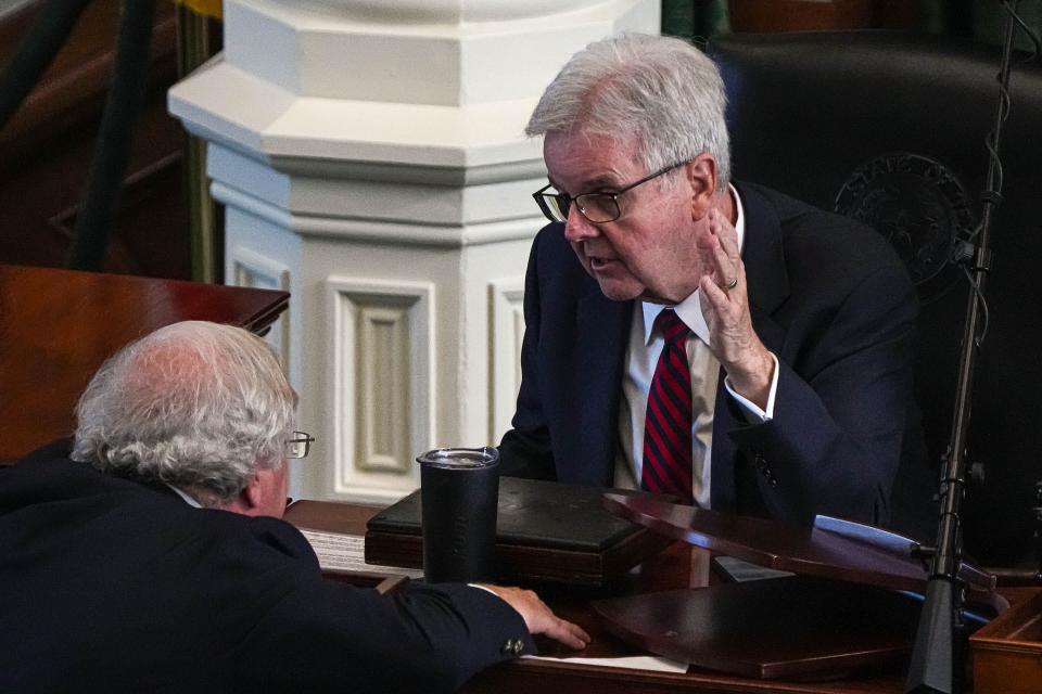 Lieutenant Governor Dan Patrick talks to Senator Paul Bettencourt during a recess in the Senate during a third Special Session at the Texas Capitol on Monday, Oct. 9, 2023 in Austin.