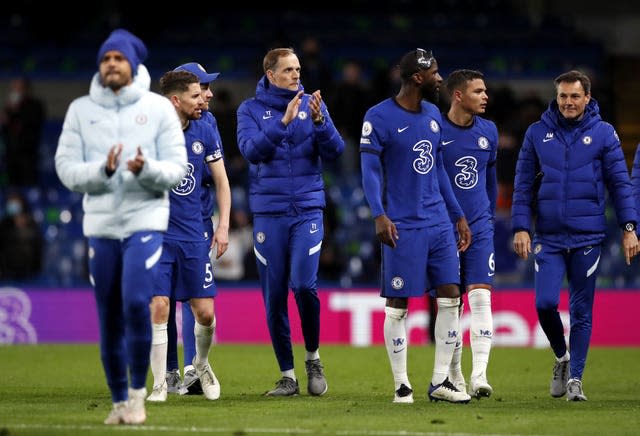 Thomas Tuchel, centre left, and his team applaud their returning fans