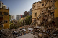 Damaged buildings are seen in a neighborhood near the site of last week's explosion that devastated the seaport of Beirut Beirut, Lebanon, Wednesday, Aug. 12, 2020. (AP Photo/Hassan Ammar)