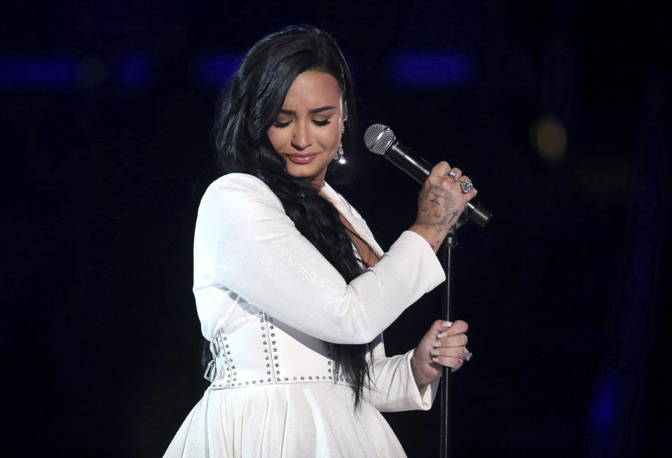 FILE - Demi Lovato performs "Anyone" at the 62nd annual Grammy Awards on Jan. 26, 2020, in Los Angeles. Lovato turns 28 on Aug. 20. (Photo by Matt Sayles/Invision/AP, File)