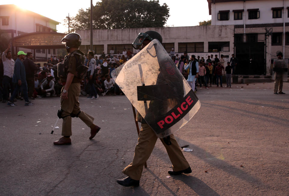 Policemen patrol in a riot affected area after clashes erupted between people demonstrating for and against a new citizenship law in New Delhi, India, February 25, 2020. REUTERS/Danish Siddiqui