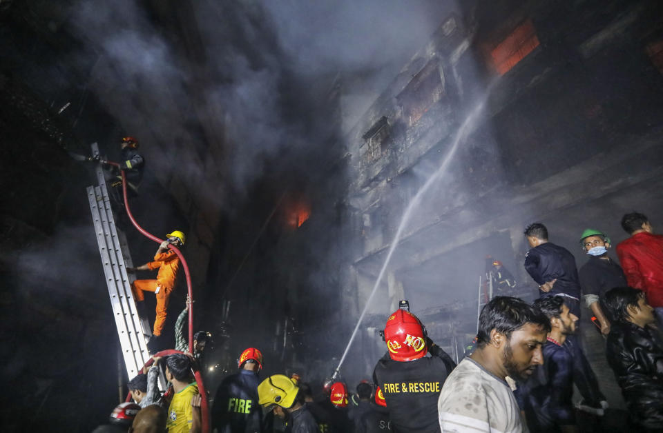 Firefighters work to douse flames in Dhaka, Bangladesh, Feb. 21, 2019. A devastating fire raced through at least five buildings in an old part of Bangladesh's capital and killed scores of people. (Photo: Zabed Hasnain Chowdhury/AP)