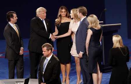 Republican U.S. presidential nominee Donald Trump (2nd from L) chats with members of his family after the conclusion of his first debate with Democratic U.S. presidential nominee Hillary Clinton at Hofstra University in Hempstead, New York, U.S., September 26, 2016. REUTERS/Adrees Latif