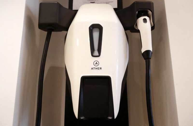 An electric scooter charging point is seen at the Ather showroom in Mumbai