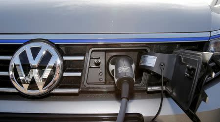 The charging plug of an electric Volkswagen Passat car is pictured at charging station at a VW dealer in Berlin, Germany, February 2, 2016. REUTERS/Fabrizio Bensch