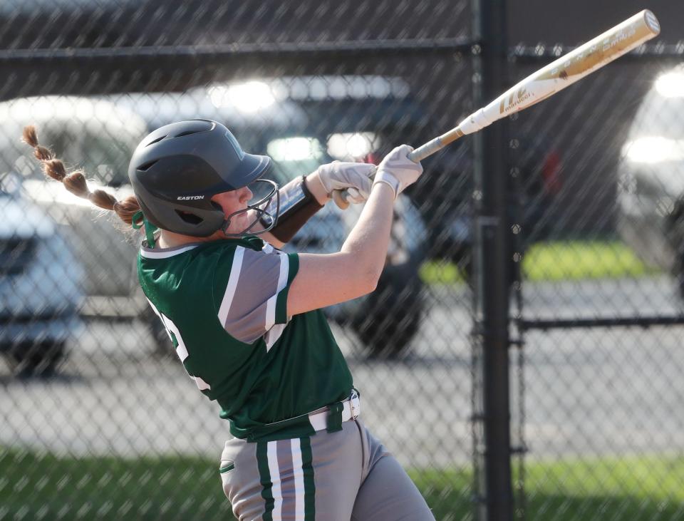 Aurora's McKennah Metzger, hitting a grand slam at Tallmadge last month, hit two homers and drove in four in Tuesday's win, while also striking out 12 in pitching a complete game.