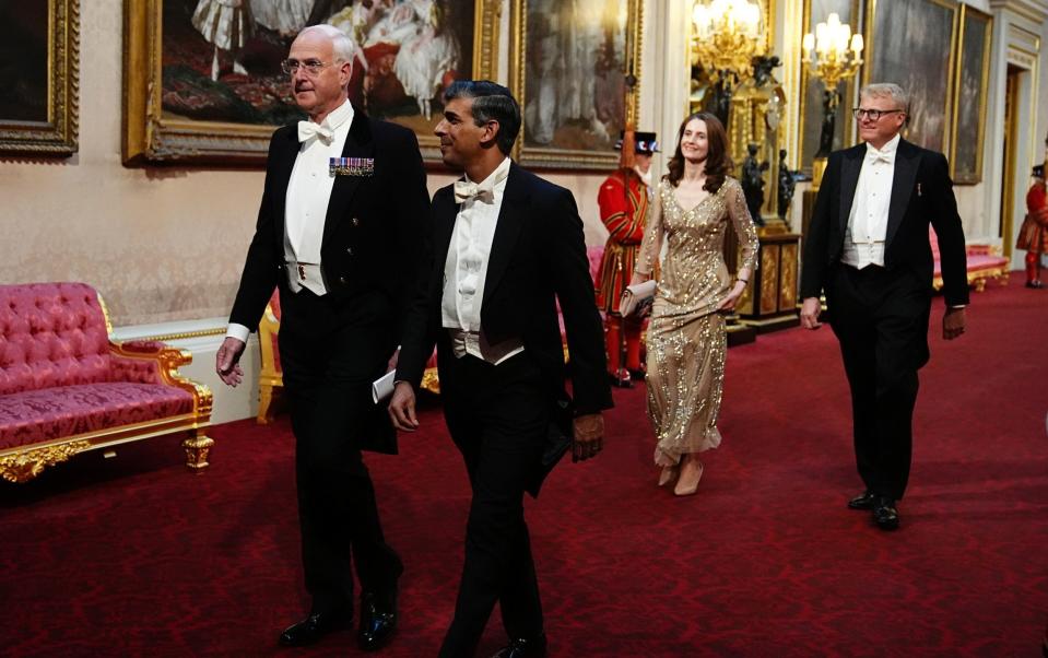 Prime Minister Rishi Sunak makes his way along the East Gallery to attend the State Banquet