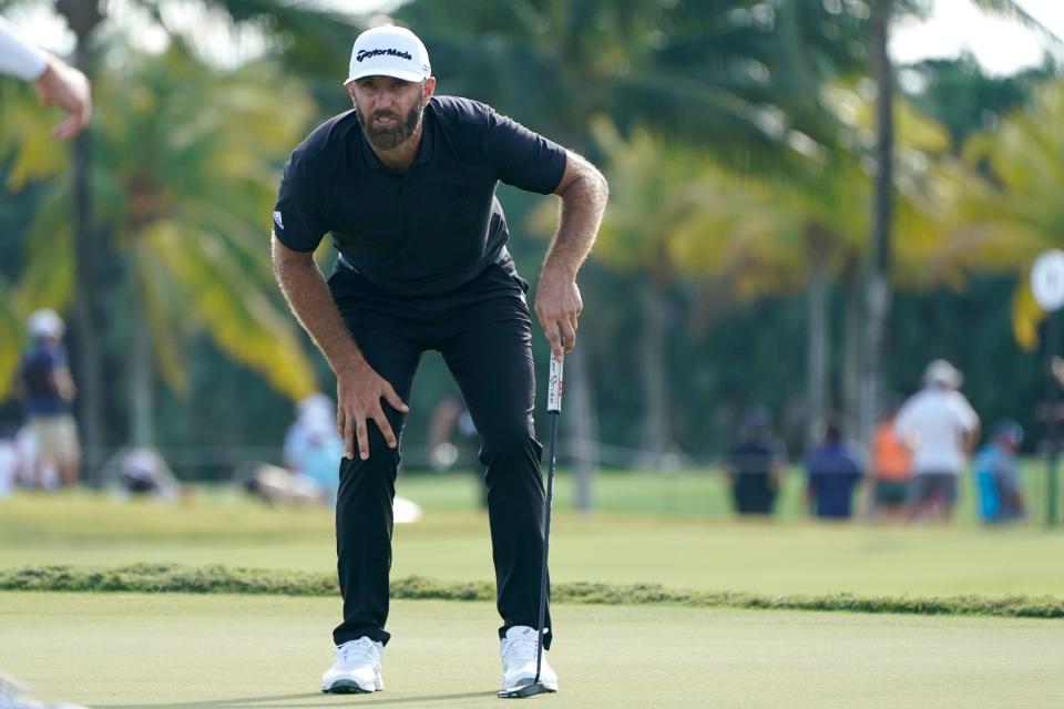FILE - Dustin Johnson reacts after putting on the 17th green during the final round of the LIV Golf Team Championship at Trump National Doral Golf Club, Oct. 30, 2022, in Doral, Fla. Players who defected from the PGA Tour to join Saudi-funded LIV Golf are still welcome at the Masters next year, even as Augusta National officials expressed disappointment Tuesday, Dec. 20, in the division it has caused in golf. (AP Photo/Lynne Sladky, File)