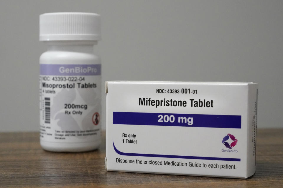 Containers of the medication used to end an early pregnancy sit on a table inside a Planned Parenthood clinic Friday, Oct. 29, 2021, in Fairview Heights, Ill. Women with unwanted pregnancies are increasingly considering getting abortion pills by mail. (AP Photo/Jeff Roberson)