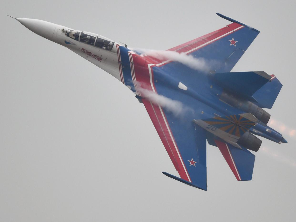 The Russian Airforce aerobatic team performs in their SU-27 jets: JOHANNES EISELE/AFP/Getty Images