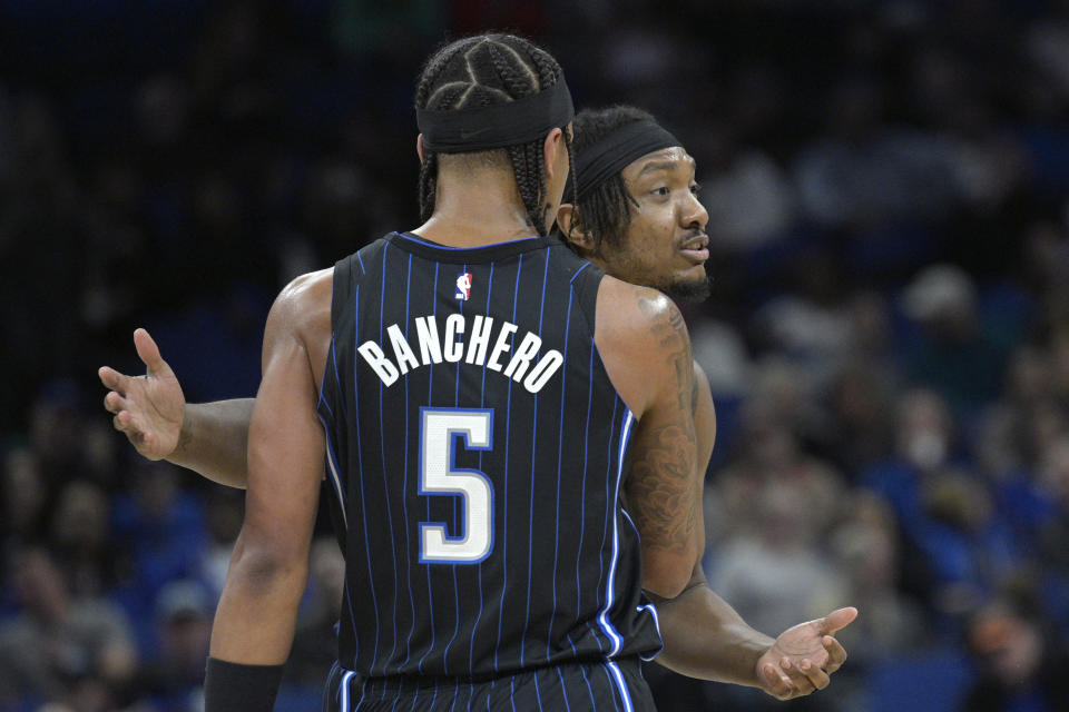 Orlando Magic center Wendell Carter Jr., right, is held back by forward Paolo Banchero (5) after he was called for a technical foul during the first half of an NBA basketball game against the Cleveland Cavaliers, Monday, Jan. 22, 2024, in Orlando, Fla. (AP Photo/Phelan M. Ebenhack)