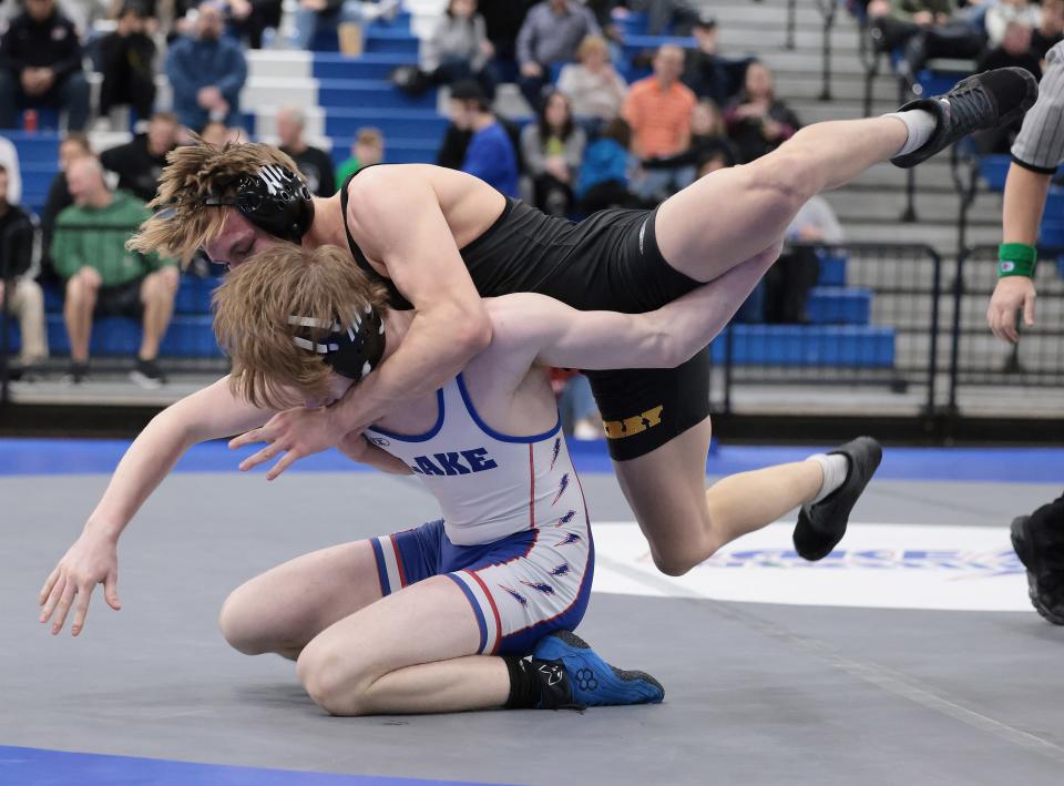 Perry's Christian Giltz,  top, was one of nine Greater Akron/Canton area middleweights to advance to the Division I quarterfinals.