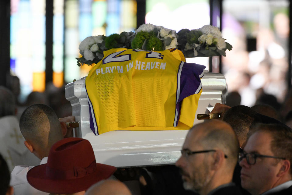 A LA Lakers gurnsey of the late Kobe Bryant, with the words 'Play'N In Heaven' is seen on the coffin of Antony as it leaves the funeral for Antony Abdallah, 13, Angelina Abdallah, 12, and Sienna Abdallah, 8, at Our Lady of Lebanon Co-Cathedral in Sydney, Monday, February 10, 2020. The three siblings were run down and killed by an alleged drunk driver in Oatlands, in Sydney's west. (AAP Image/Bianca De Marchi) NO ARCHIVING