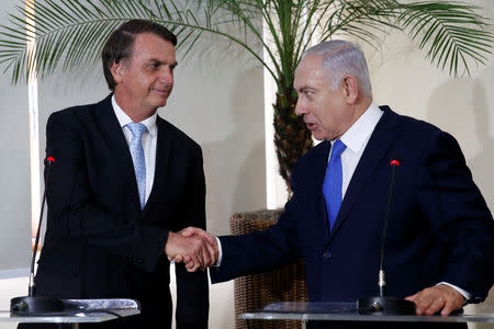 Brazil's President-elect Jair Bolsonaro greets Israeli Prime Minister Benjamin Netanyahu during a meeting in Rio de Janeiro, Brazil December 28, 2018. Fernando Frazao/Courtesy of Agencia Brasil/Handout via REUTERS