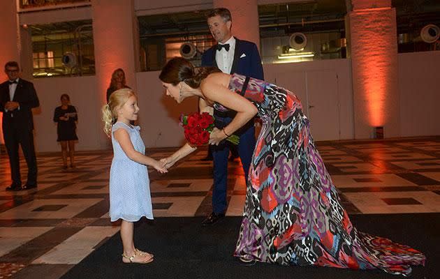 She also took the time to greet a young fan who was waiting for her at the ball. Photo: Getty.