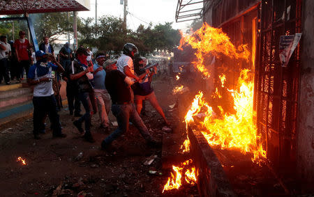 Demonstrators burn the Sandinista radio station during clashes with riot police during a protest against Nicaragua's President Daniel Ortega's government in Managua, May 30. REUTERS/Oswaldo Rivas