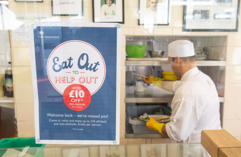 Signage for the 'Eat Out to Help Out' scheme, at the Regency Cafe, in London, one of the participating restaurants where diners will be able to enjoy half-price meals, starting on Monday as the Government kick-starts its August scheme aimed at boosting restaurant and pub trade following the lockdown.