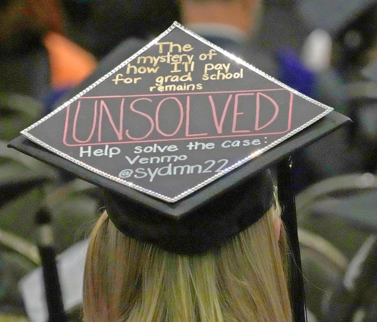 One of the many messages are displayed on a graduates cap at the last commencement ceremony for Cardinal Stritch University at the Wisconsin Center Milwaukee on Sunday. The Fox Point university announced last month it was closing its doors for good at the end of spring semester, a casualty of the demographic and financial forces haunting most every other higher education institution in Wisconsin.