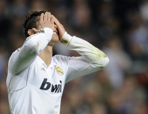 Real Madrid's Cristiano Ronaldo reacts after missing his penalty during the penalty shoot out at the Champions League second leg semi-final against Bayern Munich at the Santiago Bernabeu stadium on Wednesday. The Spanish capital is in shock after Real Madrid were knocked out of the Champions League when they lost a penalty shootout