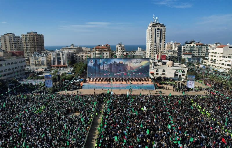 Palestinian Hamas supporters attend a rally marking the 35th anniversary of the movement founding, in Gaza City