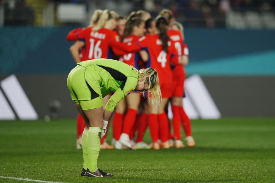 Philippines' goalkeeper Olivia McDaniel looks down as Norway players, background, celebrate their side's fifth goal during the Women's World Cup Group A soccer match between Norway and Philippines at Eden Park stadium in Auckland, New Zealand, Sunday, July 30, 2023. (AP Photo/Abbie Parr)
