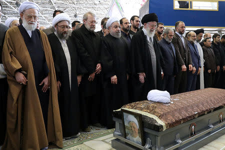 Iran's Supreme Leader Ayatollah Ali Khamenei and Iran's President Hassan Rouhani pray next to the coffin of Ali Akbar Hashemi Rafsanjani during his funeral ceremony. President.ir/Handout via REUTERS