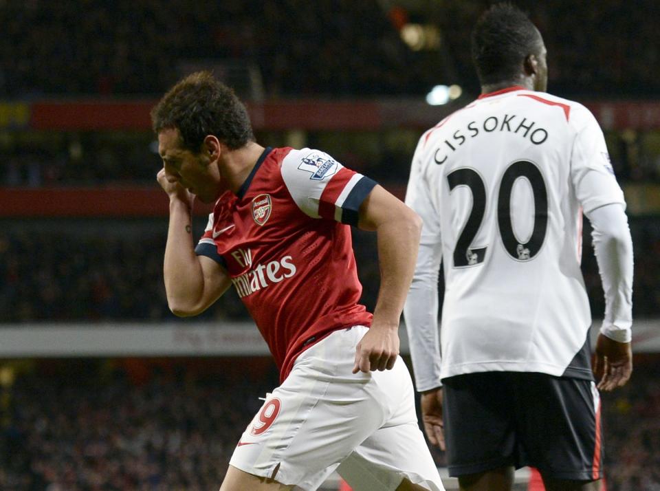 Arsenal's Cazorla celebrates after scoring a goal against Liverpool during their English Premier League soccer match at the Emirates stadium in London