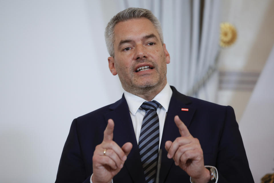 FILE - Austrian Chancellor Karl Nehammer addresses the media during a joint press conference with Hungarian Prime Minister Viktor Orban in Vienna, Austria, on July 28, 2022. Austria announced Wednesday, Sept. 28, 2022 that it will start checks at its border crossings with Slovakia, following a similar decision by the Czech Republic, in a move that’s aimed at keeping migrants from entering. (AP Photo/Theresa Wey, File)