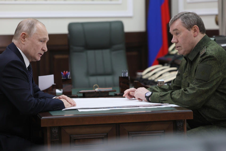 Russian President Vladimir Putin, left, and Russian Chief of General Staff Gen. Valery Gerasimov talk to each other at the headquarters of Russia's Southern Military District in Rostov-on-Don, Russia, Thursday, Oct. 19, 2023. (Gavriil Grigorov, Sputnik, Kremlin Pool Photo via AP)