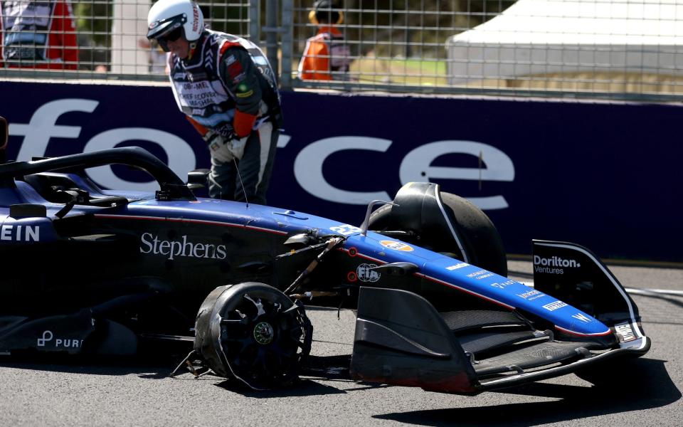 A marshal remains next to Williams' Thai driver Alexander Albon crashed during the first practice session of the Formula 1 Australian Grand Prix at the Albert Park Circuit in Melbourne on March 22, 2024