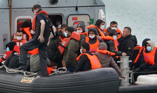 A group of people thought to be migrants are brought in to Dover, Kent, onboard a Border Force vessel following a small boat incident in the Channel (Photo: Gareth Fuller - PA Images via Getty Images)