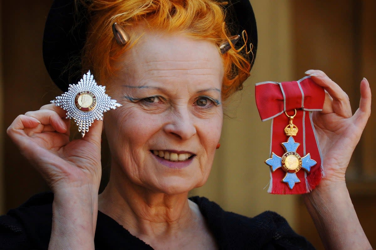 Dame Vivienne Westwood poses for a photo after collecting her insignia an Investiture ceremony at Buckingham Palace in 2006 (AP)