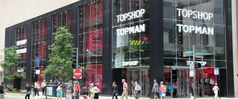 CHICAGO, USA - JUNE 26, 2013: People walk by Topshop Topman store at Magnificent Mile in Chicago. The Magnificent Mile is one of most prestigious shopping districts in the United States.