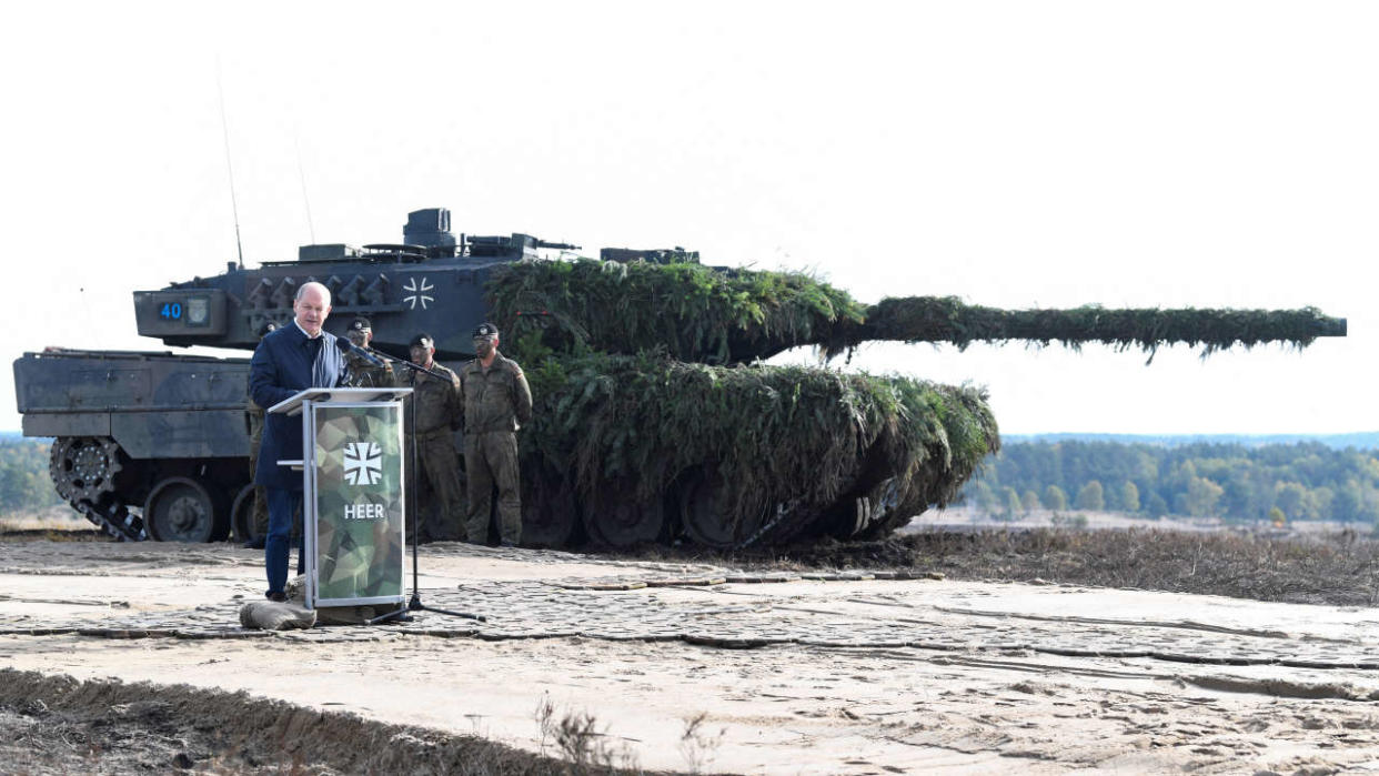 FILE PHOTO: German Chancellor Olaf Scholz delivers a speech in front of a Leopard 2 tank during a visit to a military base of the German army Bundeswehr in Bergen, Germany, October 17, 2022. REUTERS/Fabian Bimmer/File Photo