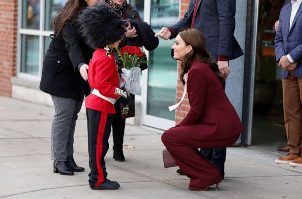 PHOTO: Henry Dynov-Teixeria, 8, presents flowers to Prince William and Kate, Princess of Wales, as his parents Melissa, left, and Irene, look on following a visit to Greentown Labs, Dec. 1, 2022, in Somerville, Mass. (Cj Gunther/AP)
