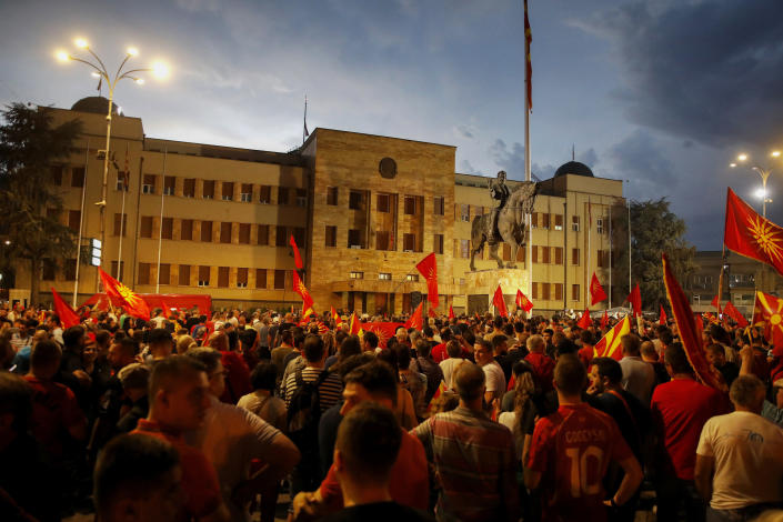 FILE - People protest in front of the parliament building in Skopje, North Macedonia, late Tuesday, July 5, 2022. Nightly protests in North Macedonia over the past week have left dozens injured. At the heart of the turmoil is the small Balkan country’s long-running quest to join the European Union, a process that has faced one hurdle after the other. (AP Photo/Boris Grdanoski, File)