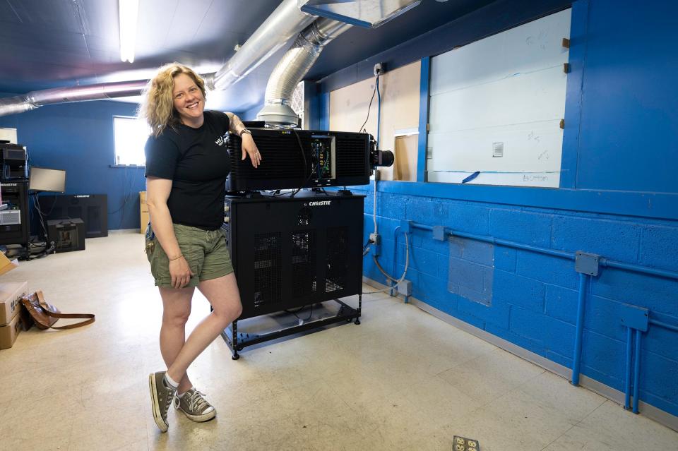 Mesa Drive-In owner Marcella Snyder poses in the projection room that sits atop the snack bar on Tuesday, May 10, 2022.