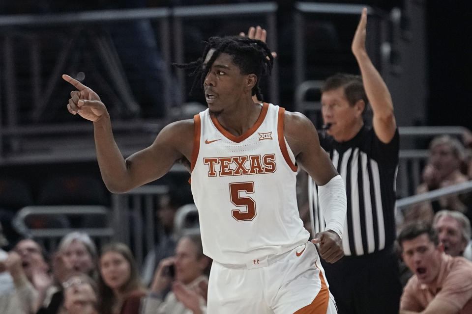 Texas guard Marcus Carr reacts to a score against Texas A&M-Commerce during the second half of an NCAA college basketball game in Austin, Texas, Tuesday, Dec. 27, 2022. (AP Photo/Eric Gay)