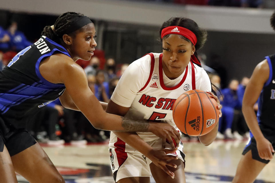 North Carolina State's Jada Boyd (5) tries to drive the lane past Duke Blue's Elizabeth Balogun (4) during the second half of an NCAA college basketball game, Sunday, Jan. 16, 2022, in Raleigh, N.C. (AP Photo/Karl B. DeBlaker)