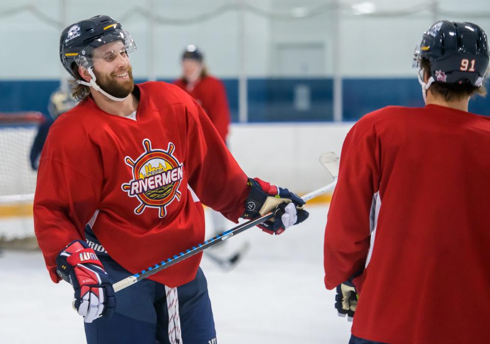 Veteran forward Jordan Ernst, left, has a laugh with teammate Alec Baer during training camp Tuesday, Oct. 10, 2023 at Owens Center.