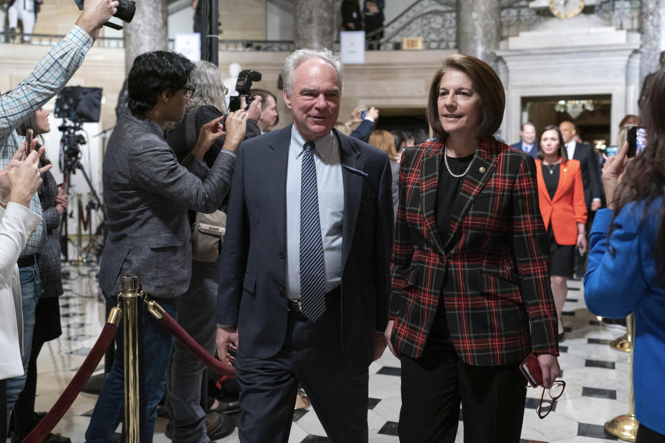 Sen. Tim Kaine, D-Va.. accompanied by Sen. Catherine Cortez Masto, D-Nev., arrives for President Joe Biden's State of the Union address to a joint session of Congress at the Capitol, Tuesday, Feb. 7, 2023, in Washington. (AP Photo/Jose Luis Magana)