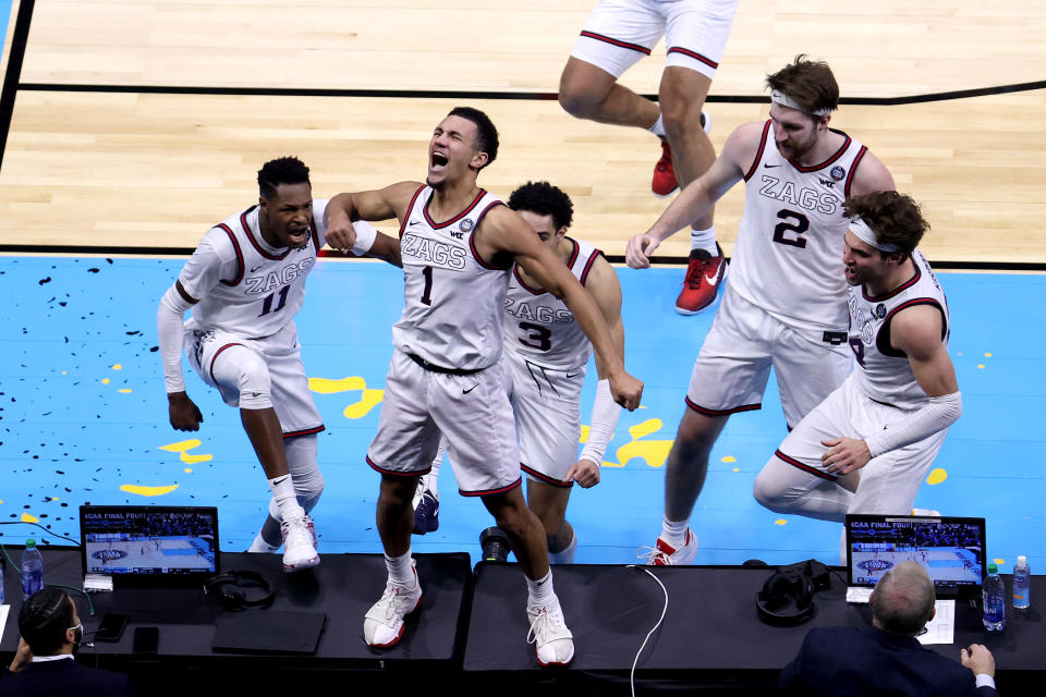 INDIANAPOLIS, INDIANA - APRIL 03: Jalen Suggs #1 of the Gonzaga Bulldogs celebrates with teammates after making a game-winning three point basket in overtime to defeat the UCLA Bruins 93-90 during the 2021 NCAA Final Four semifinal at Lucas Oil Stadium on April 03, 2021 in Indianapolis, Indiana. (Photo by Andy Lyons/Getty Images)