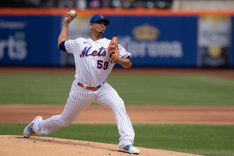 New York Mets pitcher Carlos Carrasco (59) delivers a pitch against the San Francisco Giants during the first inning at Citi Field.