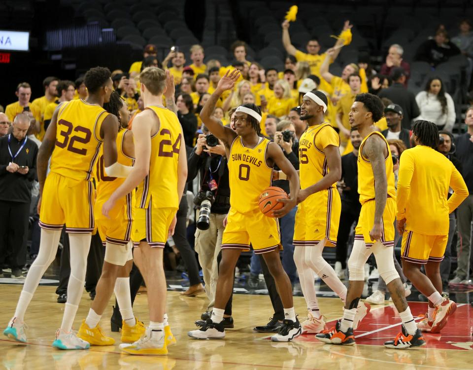 LAS VEGAS, NEVADA - DECEMBER 12: The Arizona State Sun Devils, including DJ Horne #0, celebrate on the court after the team's 73-71 victory over the Creighton Bluejays during the Jack Jones Hoopfest basketball tournament at Michelob ULTRA Arena on December 12, 2022 in Las Vegas, Nevada. (Photo by Ethan Miller/Getty Images)